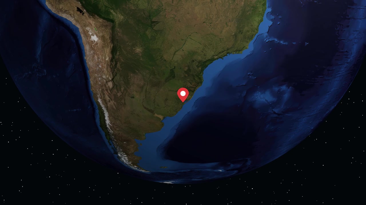 Digital globe rotates and zooms into South America, highlighting Pelotas Brazil with informational text
