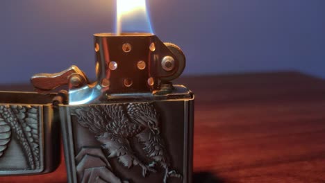 close up eagle lighter flame on a table