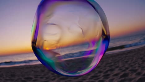 iridescent soap bubble at sunset beach