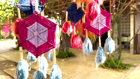 vibrant mobiles sway in a thai garden