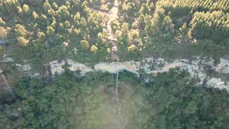 Aerial-view-of-the-Devonian-Escarpment-over-the-Perau-Waterfall,-Paraná,-Brazil