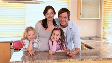 Happy-family-using-a-tablet-computer