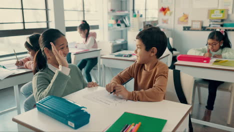 Teacher,-child-and-high-five-in-classroom