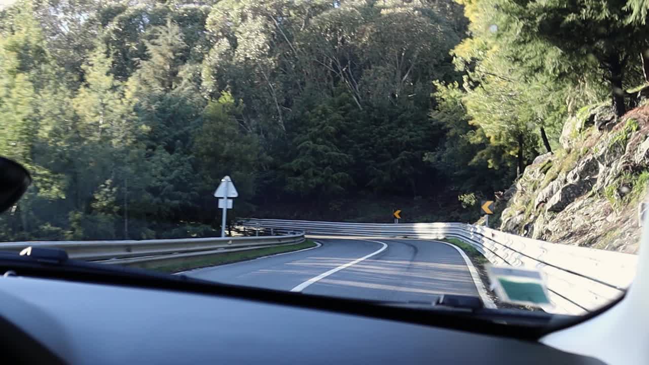 Driving on Road in Serra da Estrela Natural Park on Steep Winding Roads With Rocky Cliff and Guard Railing
