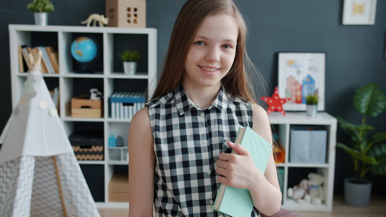 Girl Holding a Book in a Playroom