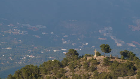 christian cross on the mountain in la nucia spain