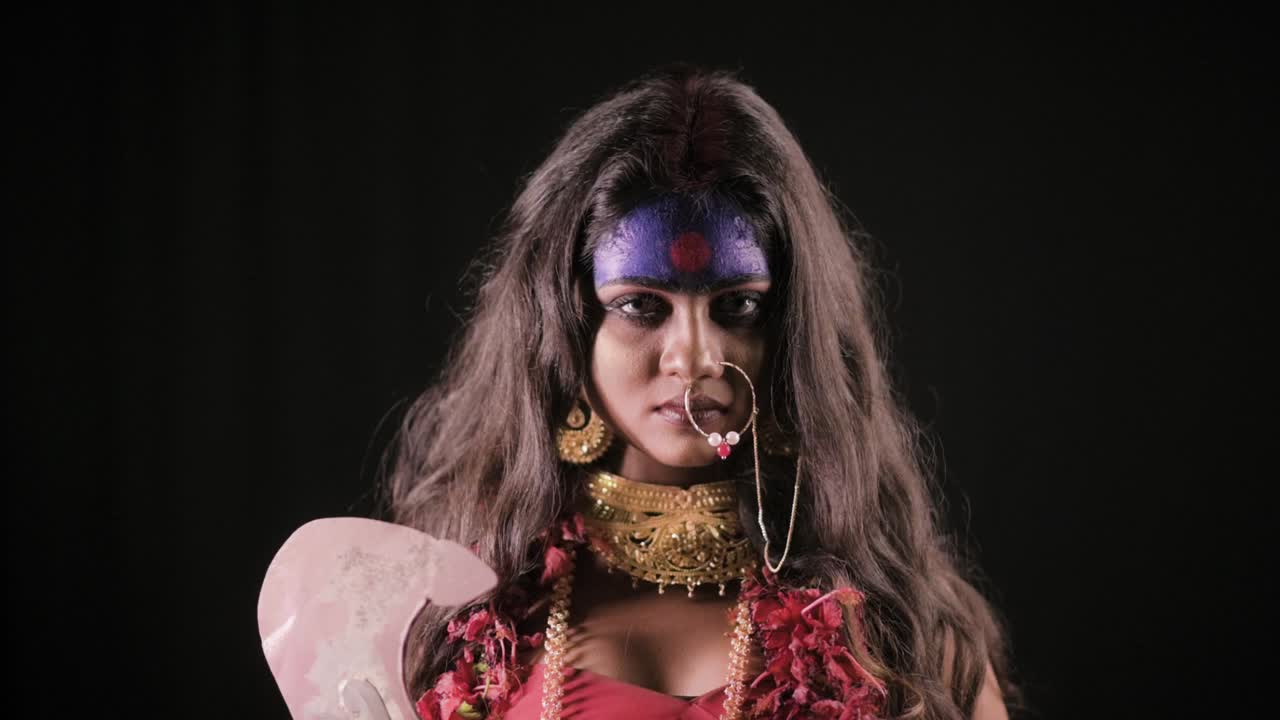 Live Indian Goddess Kali Opens Her Eyes And Looks At Camera, Indian Goddess  Cosplay With Long Hair And Dark Background Free Stock Video Footage  Download Clips