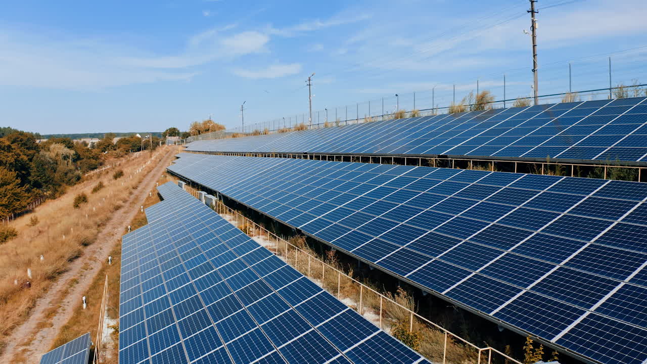 Green environmental solar panels on a field. Photovoltic ecology solar power station.