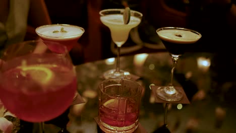 friends enjoying cocktails at a bangkok bar