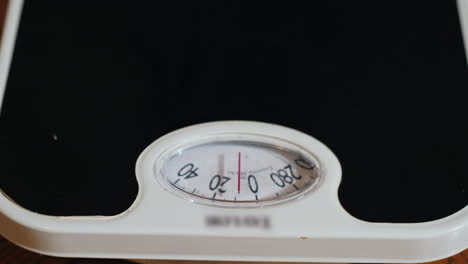 Man-Weighs-Himself-On-Floor-Scales-05