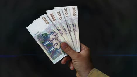 algeria dinar money fan of banknotes in hand