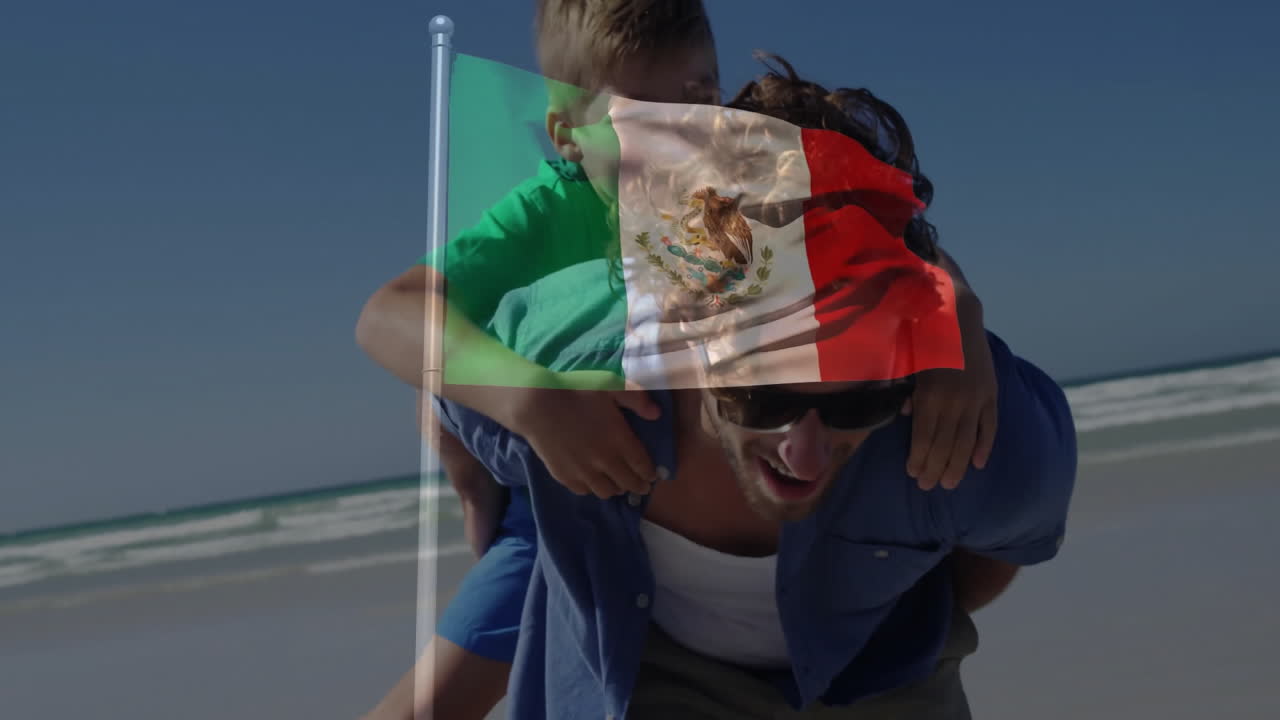 In spiaggia, uomo che porta un bambino in spalla con animazione della bandiera messicana.