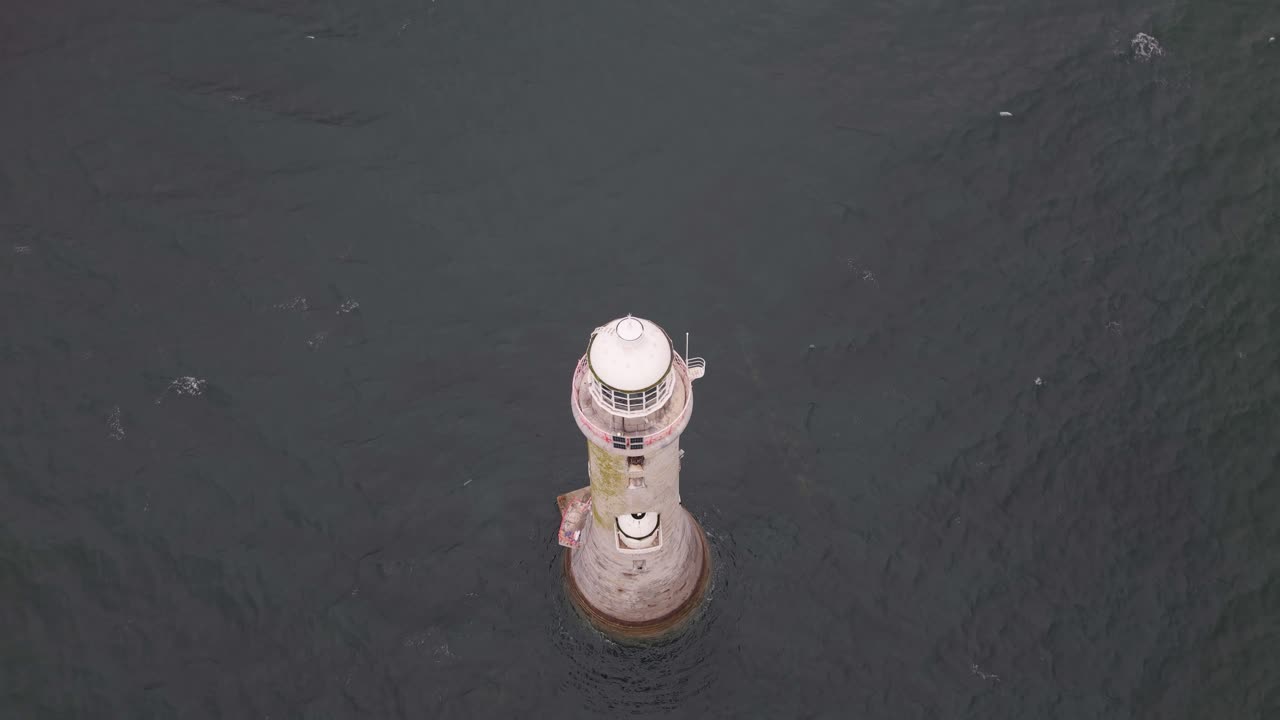 Isolation and Resilience: Haulbowline Lighthouse Standing Alone in the Ocean