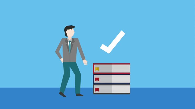 businessman stacked books check mark