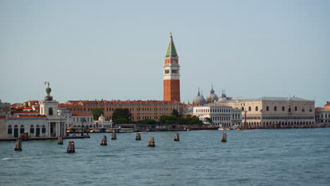 view from the sea of bell tower of st mark's campanile in venice, italy - wide