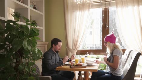 couple enjoying breakfast in a cozy restaurant
