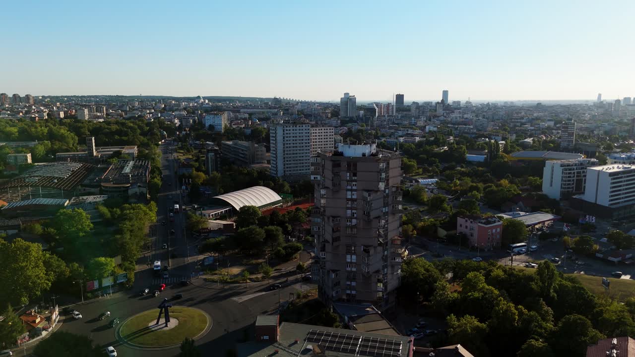 drone rotate around of Karaburma Housing Tower in Belgrade, Serbia at sunset