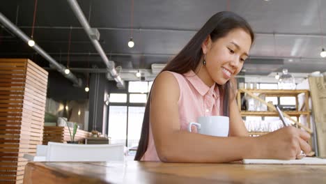 teenage girl writing on a diary 4k