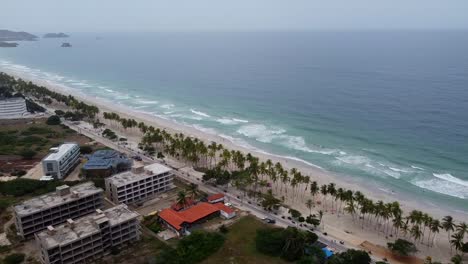 Aerial-view-of-many-motorcycle-riding-on-coastal-road-in-Venezuela