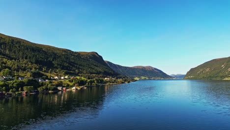 Aerial-over-Syvdsfjorden-near-Syvde-on-a-lovely-sunny-day,-Vanylven-Municipality,-Norway