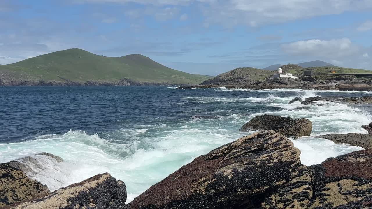 Ireland Epic Locations waves crash ashore at Valencia Lighthouse wild Irish places on The Ring of Kerry