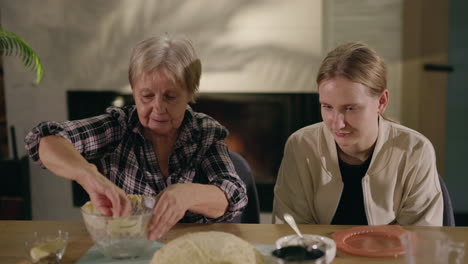 grandmother and granddaughter baking together