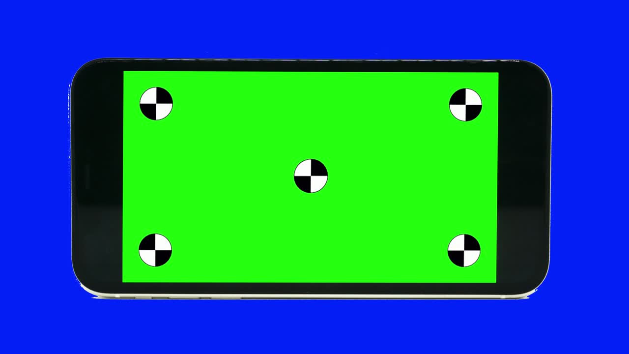 Green screen technology concept. Modern smart phone, tablet and computer mock up with green screen, alpha channel and tracking markers.