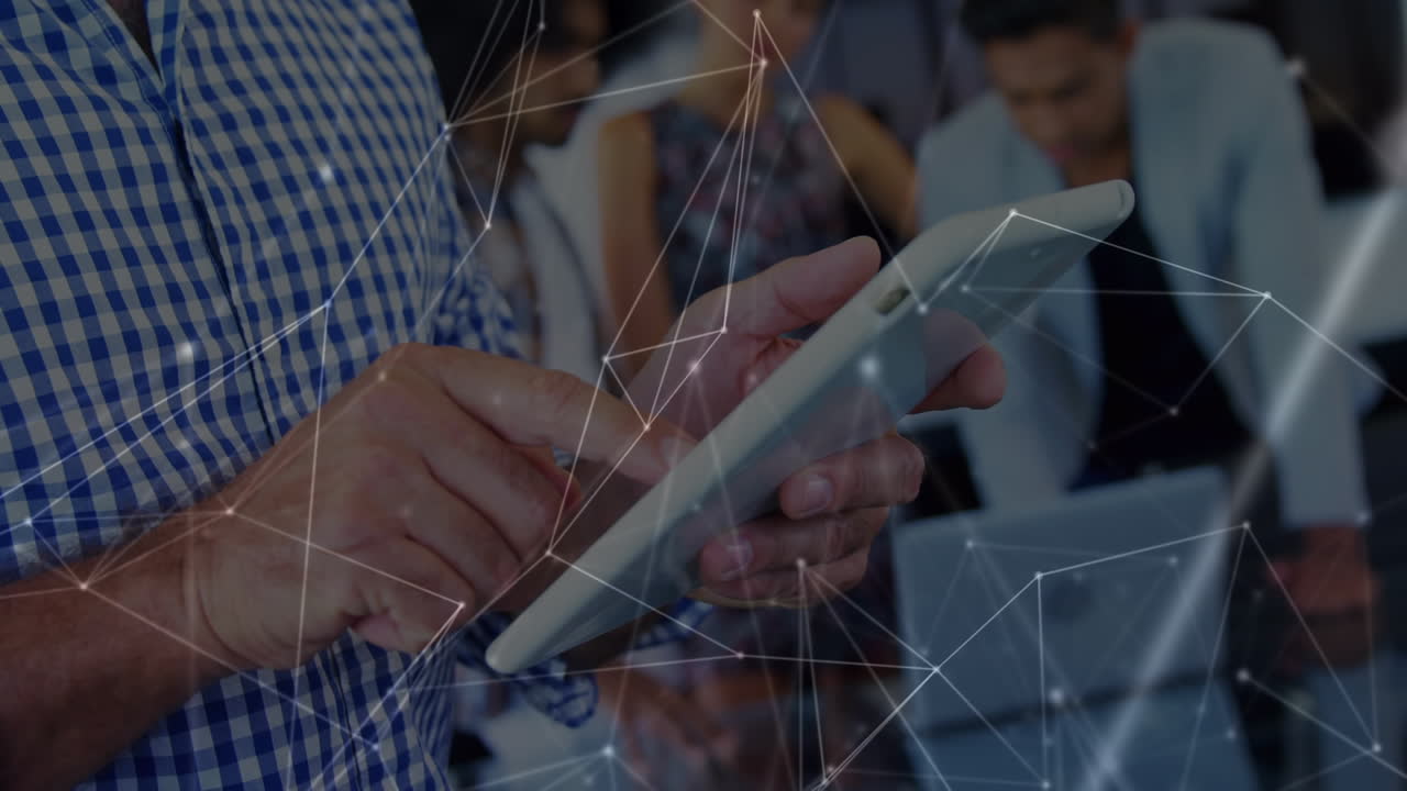 Animation of network of connections over caucasian businessman using tablet