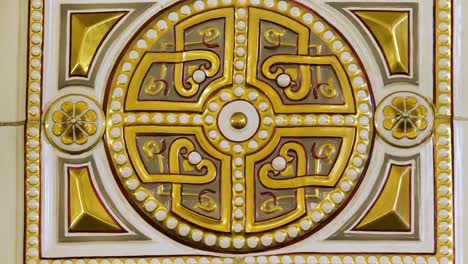 ornate decorative tiles with gold accents