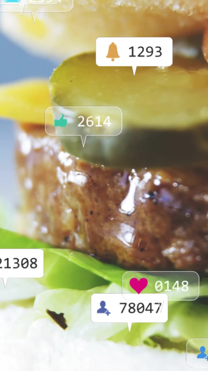 Vertikal video: Sociale bobler dukker op, kamera panorerer burger, der afslører lag og øger likes.