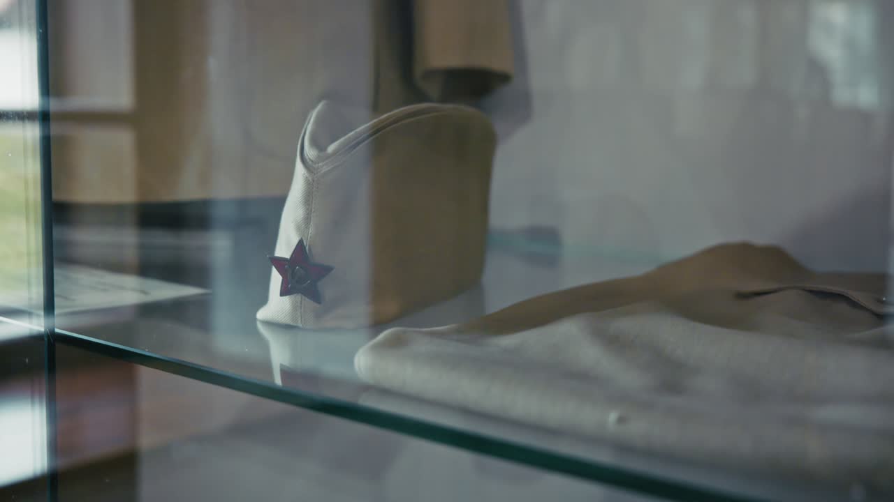 Yugoslav military cap with red star on display, showcasing history in Kumrovec, Croatia