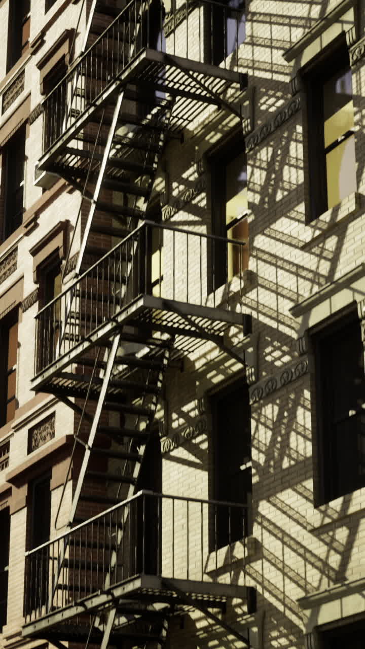 Urban architecture showcases fire escapes and shadows at twilight hour