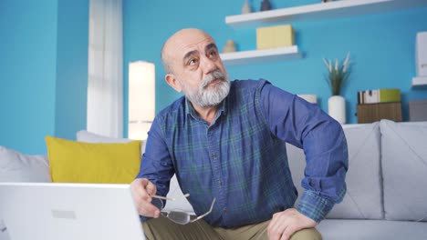 Old-man-at-home-looking-thoughtfully-and-strangely.