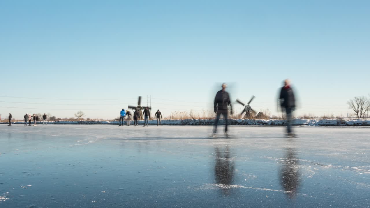 Time lapse of people ice skating on frozen canal in Netherlands, winter scenery