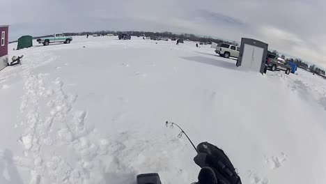 A-Person-Enjoying-Ice-Fishing-Outdoors---High-Angle-Shot