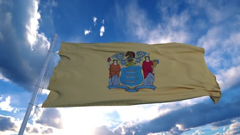 nueva bandera de jersey en un asta de bandera ondeando en el viento, fondo de cielo azul. 4k