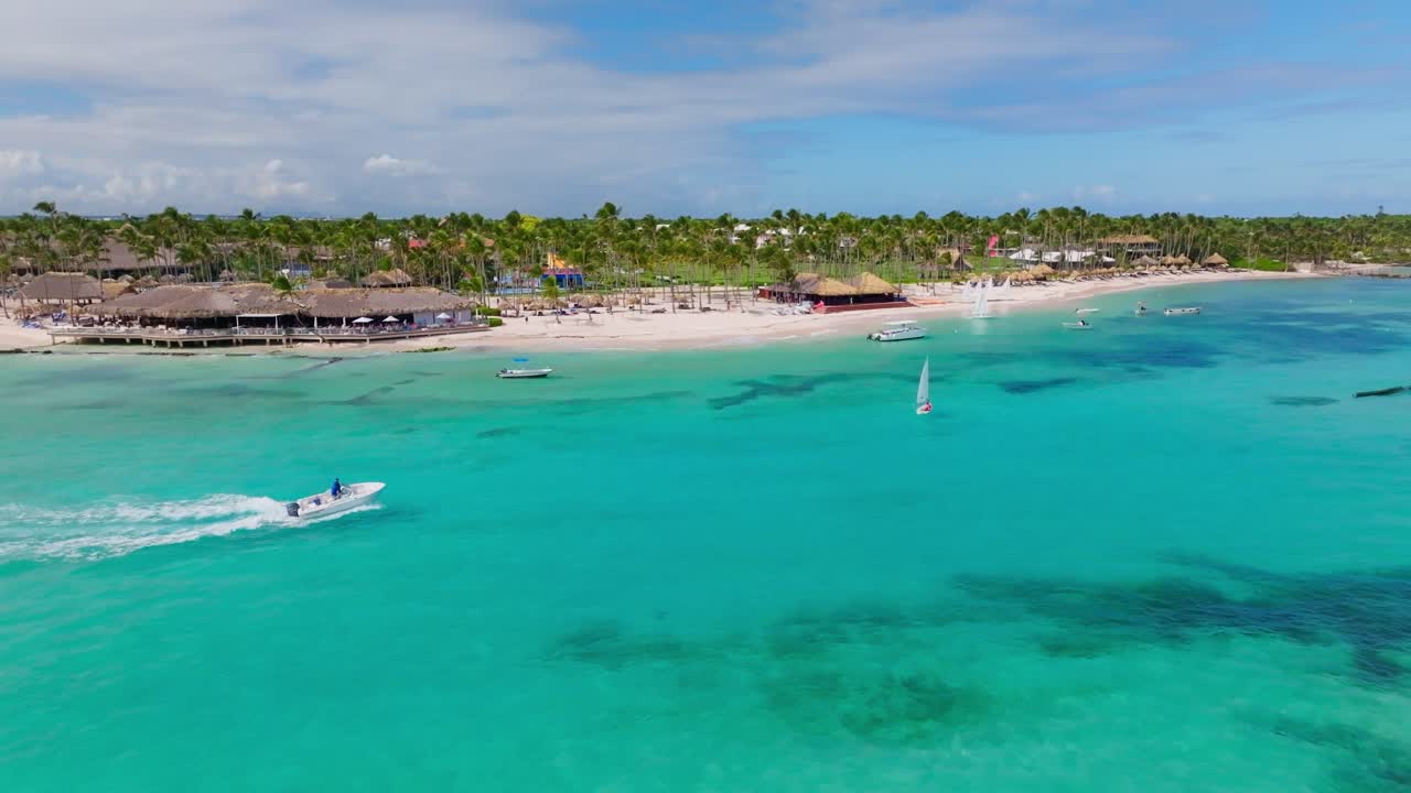 Boat cruise along Caribbean coastline - sandy beach, palms, turquoise sea, Playa Blanca in Punta Cana