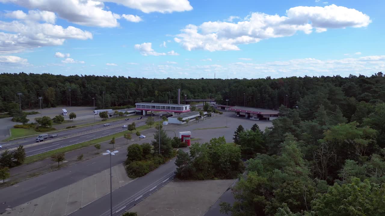 highway rest stop with cars driving on a multi lane highway. speed ramp hyper motion time lapse