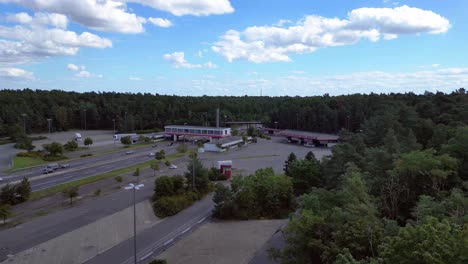 highway rest stop with cars driving on a multi lane highway. speed ramp hyper motion time lapse