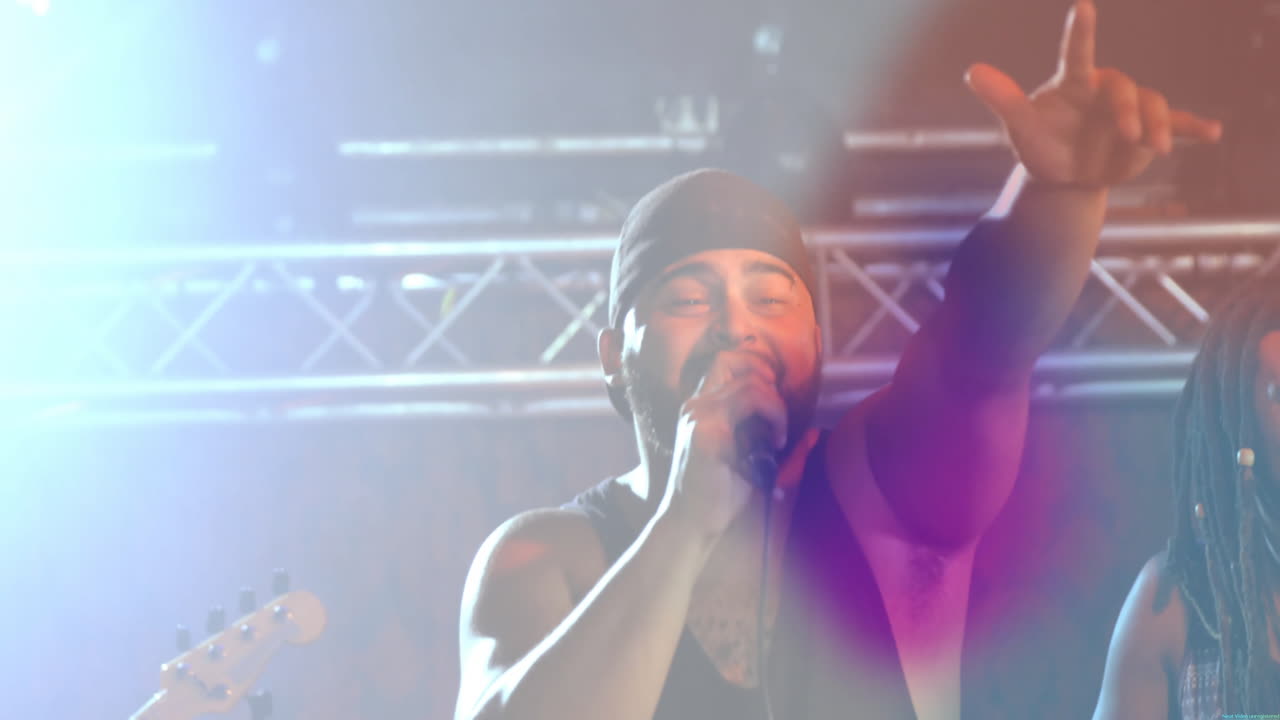 Male singer holding mic raising hand for music marketing on stage, with animated equalizer pulsing