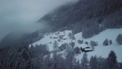 Aerial-drone-view-of-picturesque-frozen-mountainous-landscape-in-wintertime