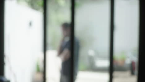 blurred view through glass door