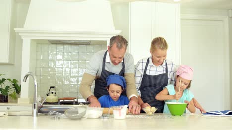 Family-preparing-dessert-in-kitchen