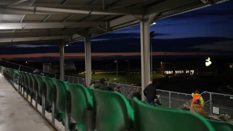 speedway racing at night: spectators in the stands