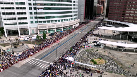 fans line roadside of central denver during nuggets championship parade