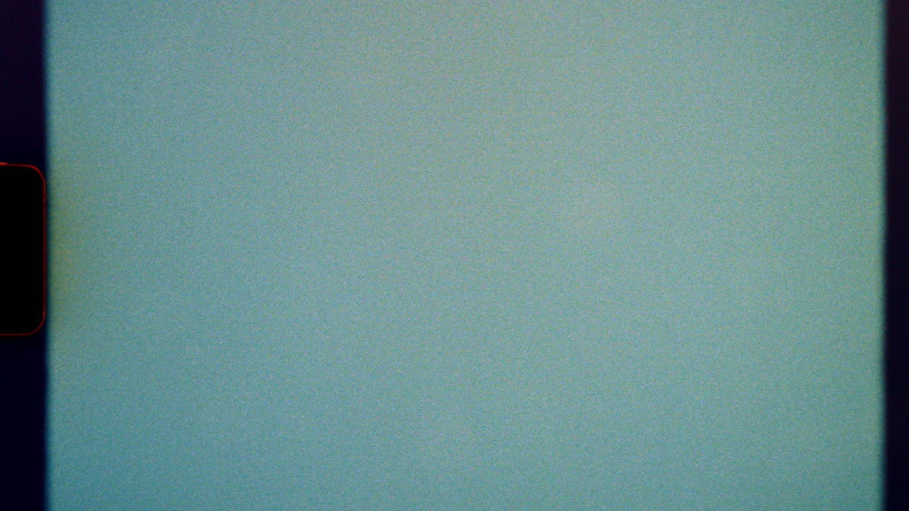 Blue-toned 8mm film background with light noise and analog frame