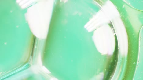 animation of bubbles moving on green background with copy space