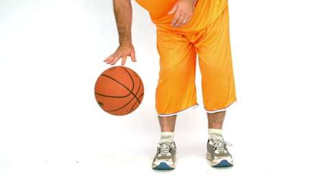 man dribbling a basketball