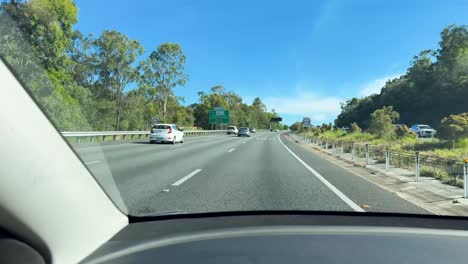 car travels along scenic australian highway