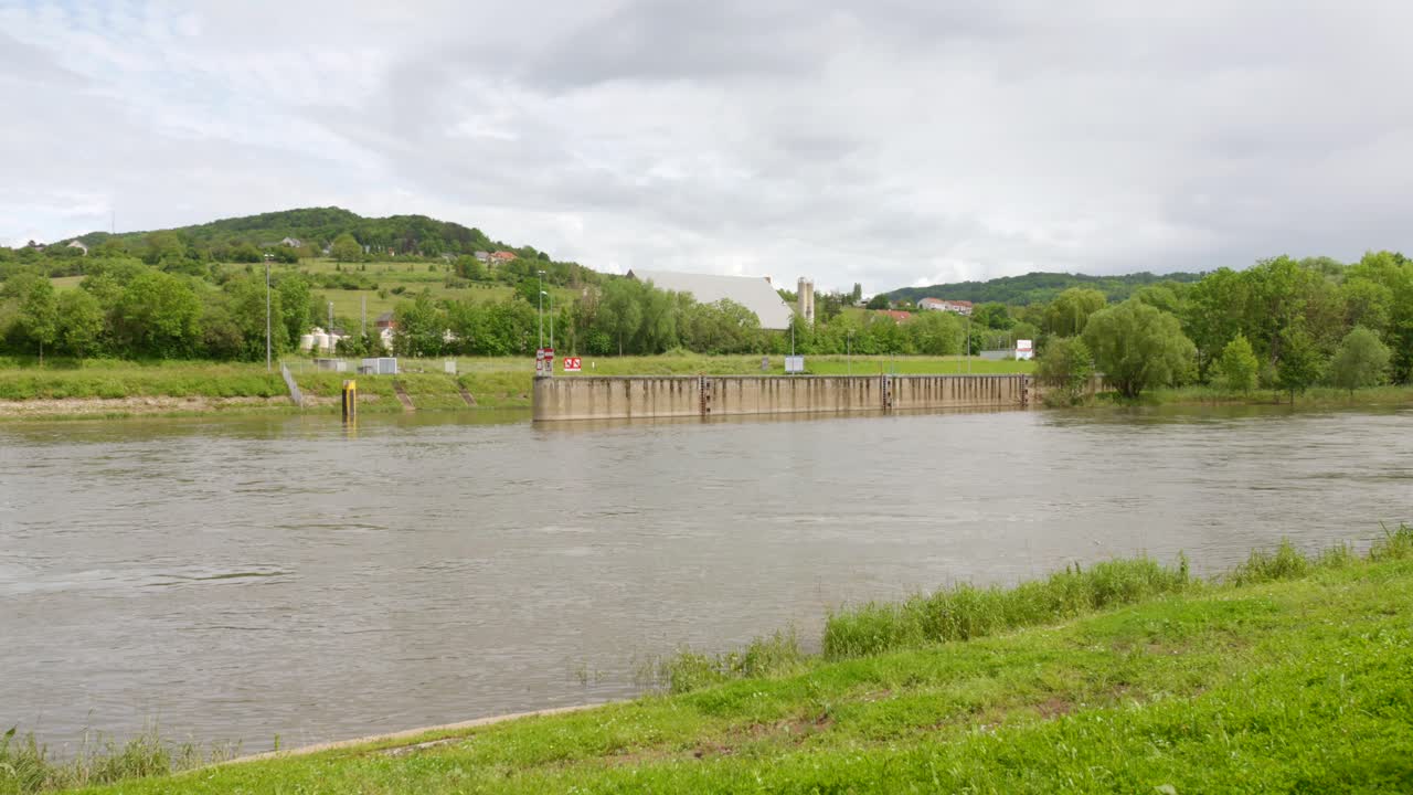 Profile view of Schengen dam in Schengen, Luxembourg on a cloudy day. Town famous for the signing of the Schengen Treaty.